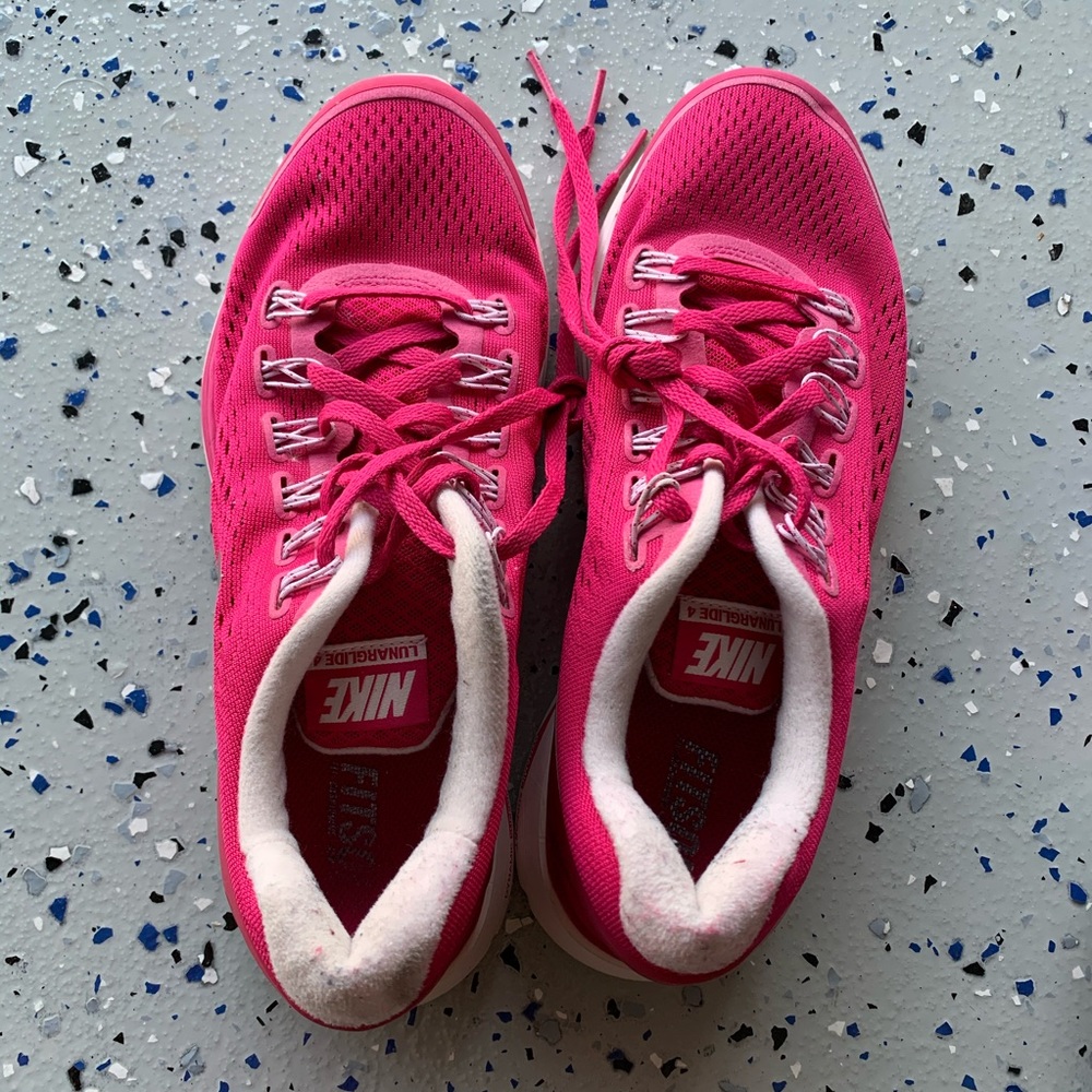 Women pink Nike running shoes 9